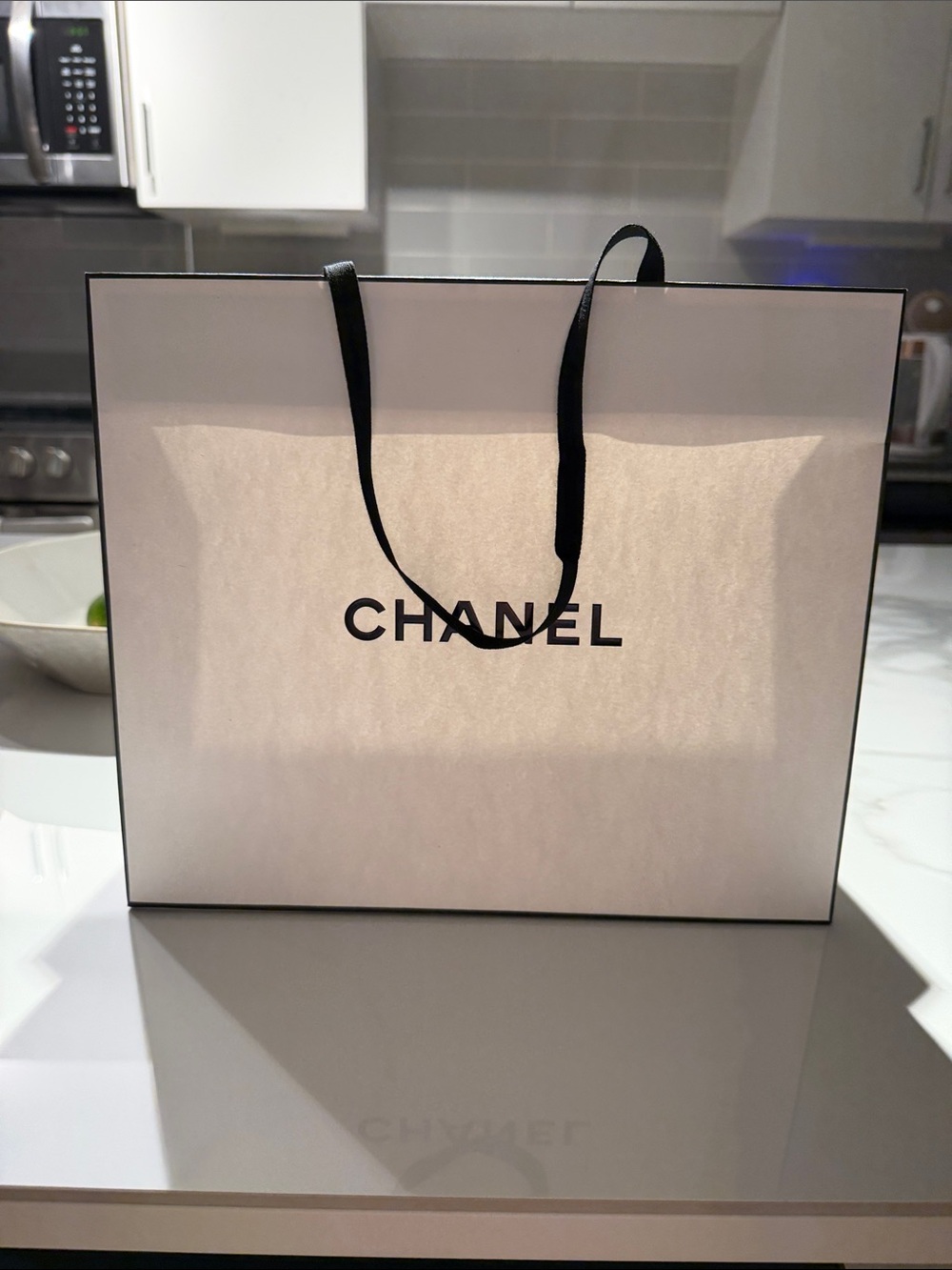 CHANEL White Shopping Bag with Black Ribbon Handles